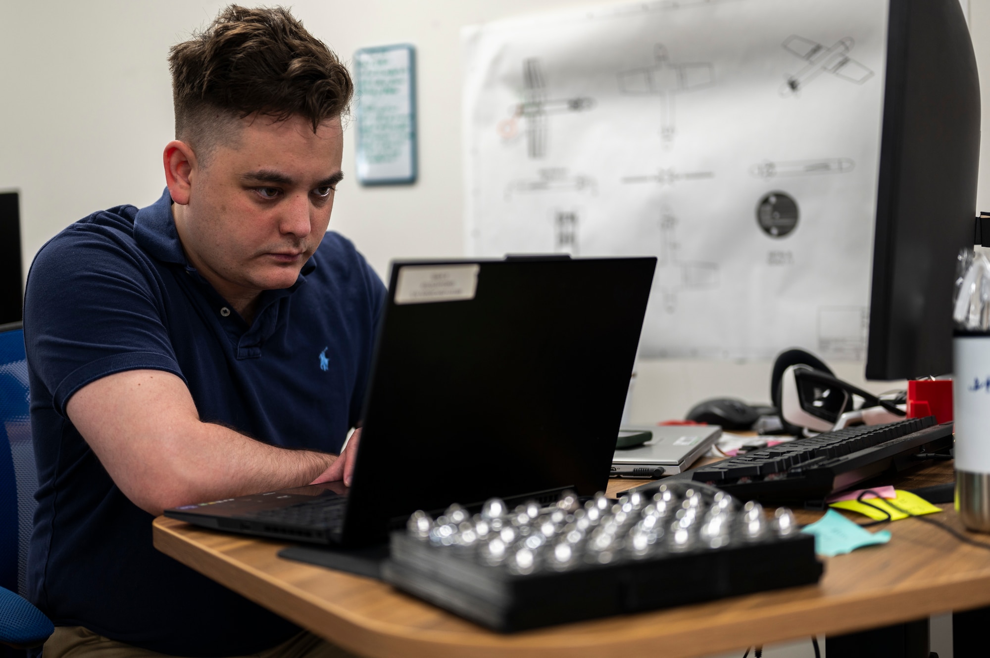 Airman at workdesk
