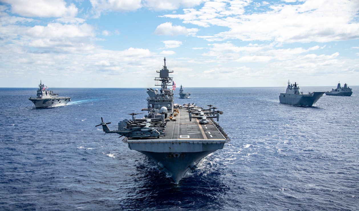 The forward-deployed amphibious assault ship USS America (LHA 6), flag ship of the America Strike Group, steams alongside U.S. Navy ships from the America Strike Group, Royal Australian Navy, Republic of Korea Navy, Royal New Zealand Navy, French Navy and Japan Maritime Self-Defense Force while in formation during a formation exercise as part of Talisman Sabre 25, July 20.