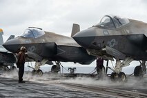 Sailors prepare to conduct flight operations on the flight deck of the Nimitz-class aircraft carrier USS Carl Vinson (CVN 70), July 21, 2025.