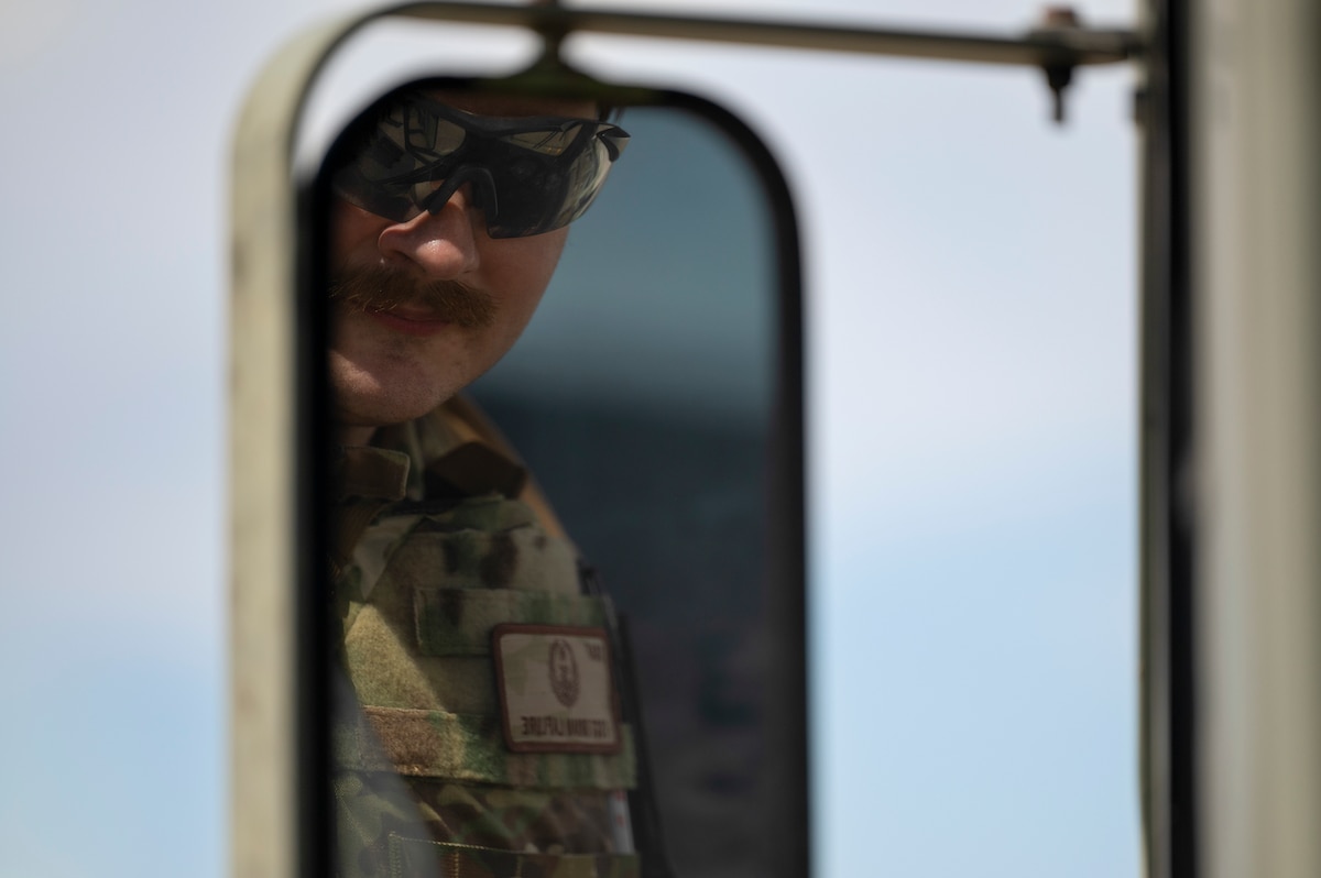 Airman looks out window