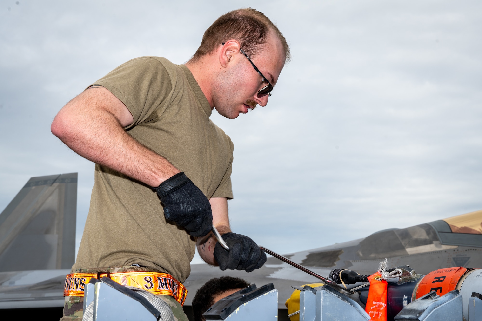 U.S. Air Force Senior Airman Joshua Rowan, a munitions build crew member assigned to the 3rd Munitions Squadron, assembles munitions during the second quarter mission generation competition at Joint Base Elemendorf-Richardson, Alaska, July 18, 2025.