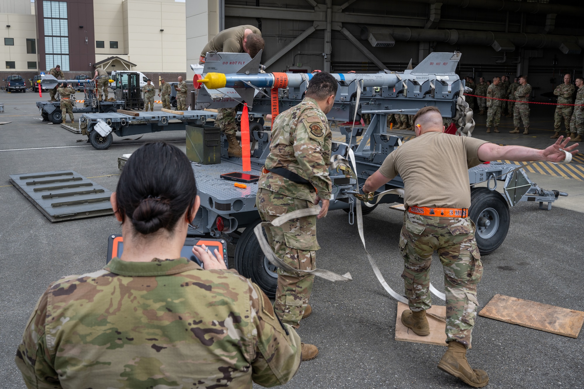 U.S. Air Force Airmen assigned to the 3rd Munitions Squadron assemble munitions during the second quarter mission generation competition at Joint Base Elmendorf-Richardson, Alaska, July 18, 2025.