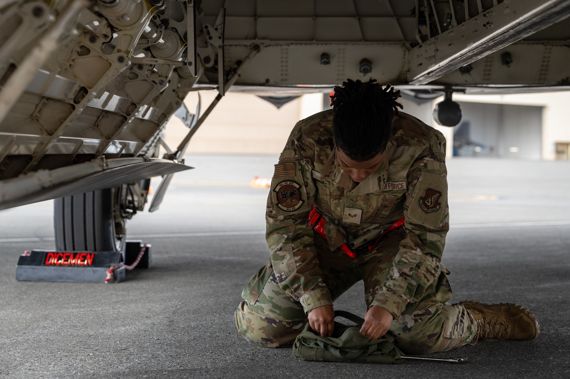 U.S. Air Force Senior Airman Megan Ross, weapons load crew member assigned to the 90th Fighter generation Squadron, prepares her tools during the second quarter mission generation competition at Joint Base Elmendorf-Richardson, Alaska, July 18, 2025.