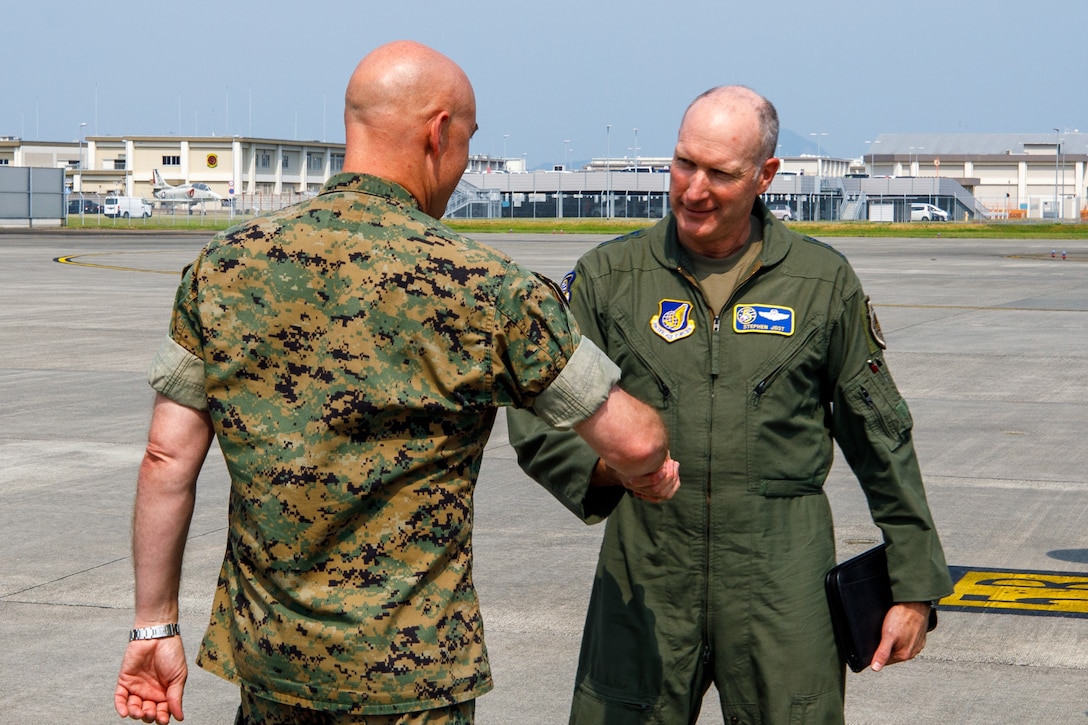 U.S. Marine Corps Col. Kenneth Rossman, left, commanding officer, Marine Corps Air Station Iwakuni, greets Lt. Gen. Stephen Jost, commanding officer, U.S. Forces Japan, meet during exercise Resolute Force Pacific (REFORPAC) 2025, at MCAS Iwakuni, Japan, July 16, 2025. REFORPAC demonstrates U.S. commitment to the region by building interoperability, multilateral cooperative arrangements with our allies and partners, advancing common interests, and ensuring a free and open Indo-Pacific. (U.S. Marine Corps photo by Lance Cpl. David Getz)