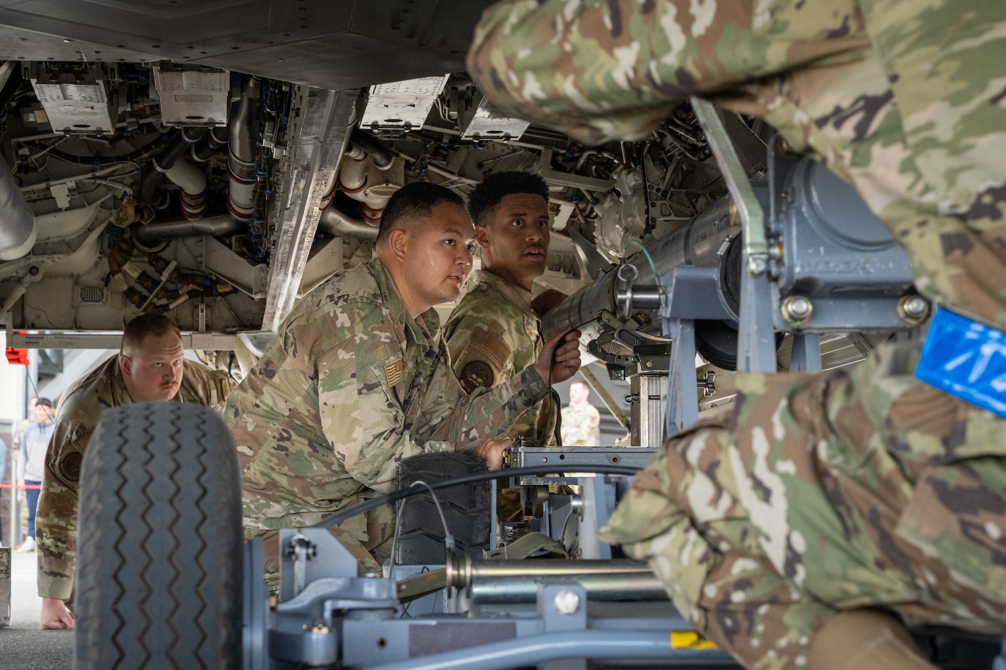 U.S. Air Force Airmen assigned to the 525th Fighter Generation Squadron load munitions into a F-22 Raptor during the second quarter mission generation competition at Joint Base Elmendorf-Richardson, Alaska, July 18, 2025.