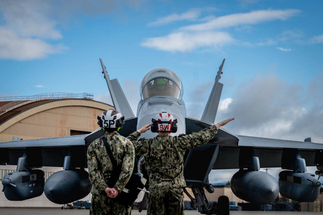 U.S. Navy personnel perform pre-flight checks for an EA-18G Growler assigned to the Electronic Attack Squadron (VAQ) 138 before taxiing during Red Flag-Alaska 25-3 at Eielson Air Force Base, Alaska, July 22, 2025.