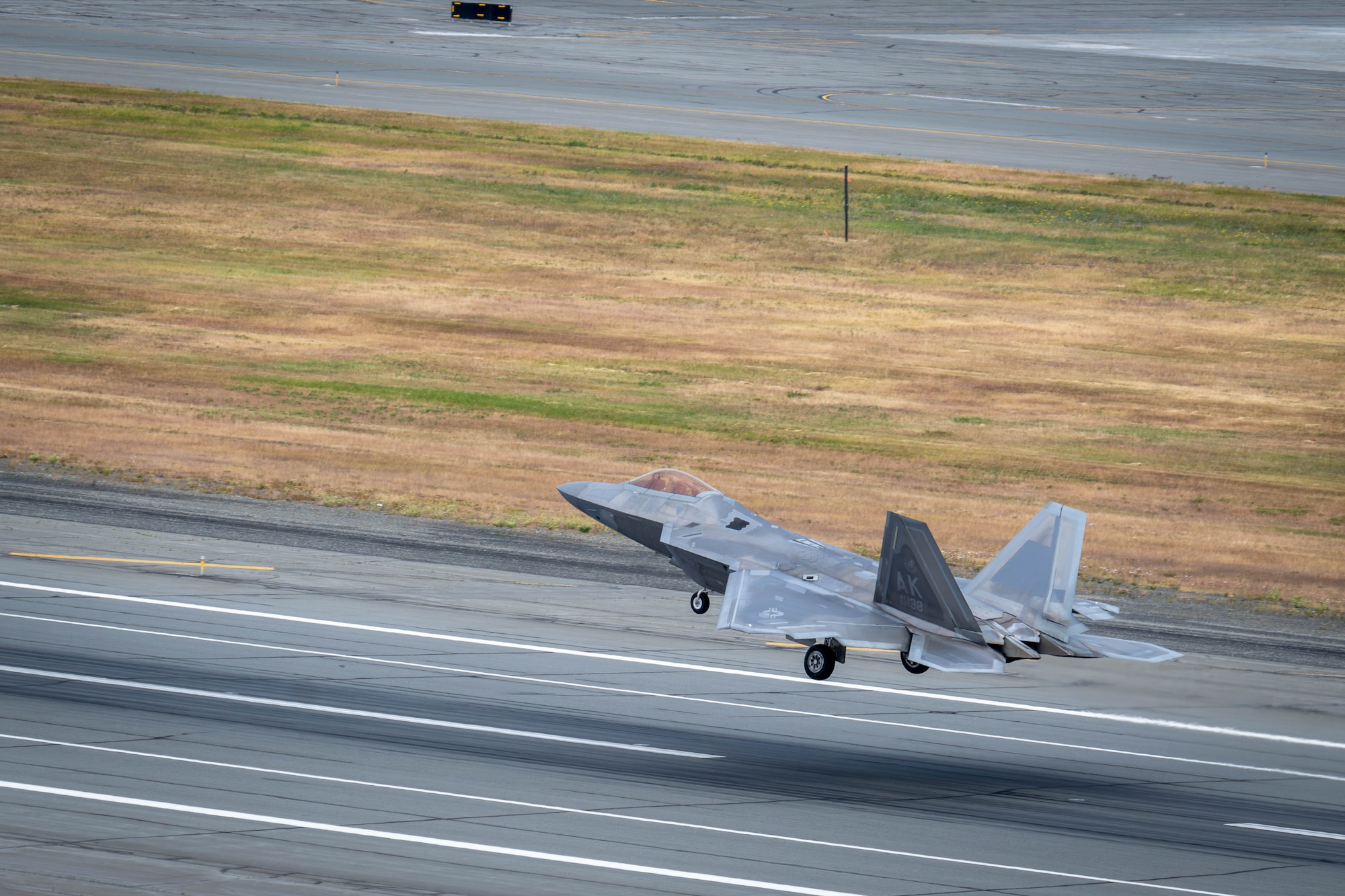 A U.S. Air Force F-22 Raptor assigned to the 90th Fighter Squadron takes off during exercise Resolute Force Pacific on Joint Base Elmendorf-Richardson, Alaska, July 13, 2025.