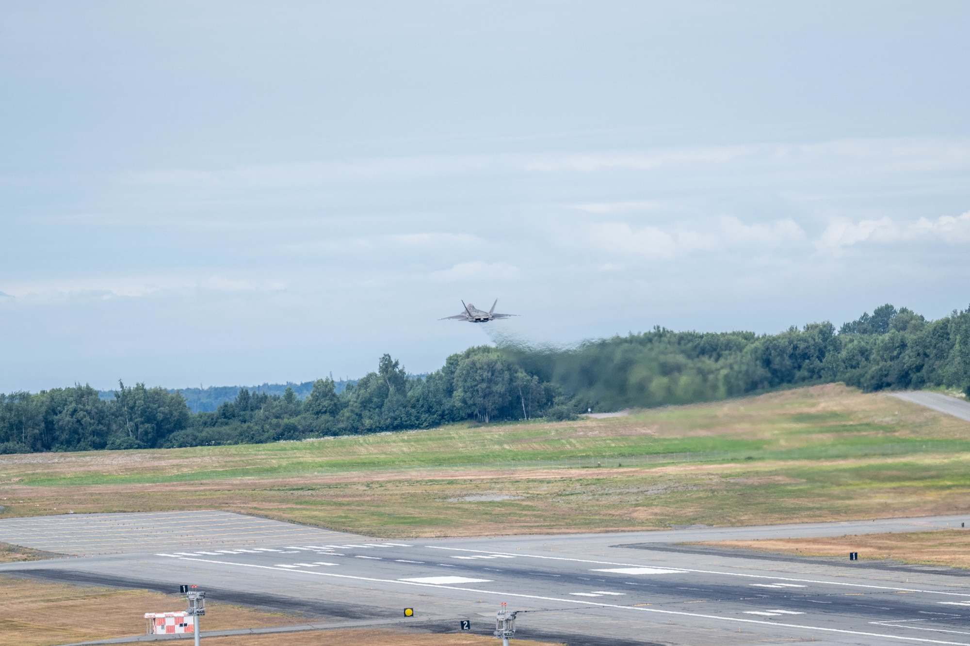 A U.S. Air Force F-22 Raptor assigned to the 90th Fighter Squadron takes off during exercise Resolute Force Pacific on Joint Base Elmendorf-Richardson, Alaska, July 13, 2025.