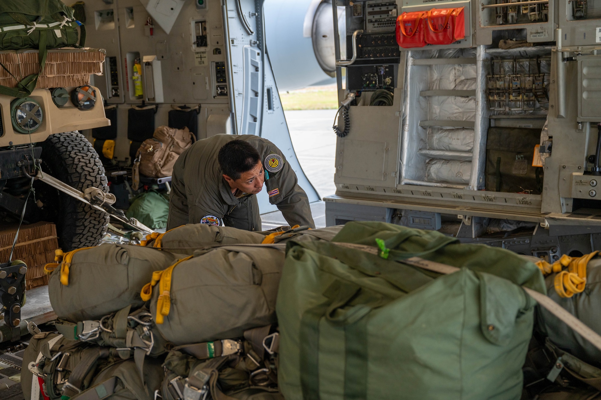 An Airmen loads equipment onto a C-17.