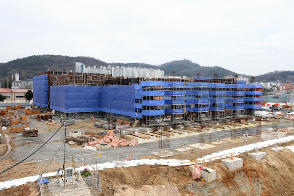 Construction is underway on the new, uniquely designed two-story Vehicle Maintenance Facility (VMF) at Camp Carroll, South Korea. Managed by the U.S. Army Corps of Engineers, Far East District, the $44 million facility includes multiple work bays, integrated workshops, wash bays, and eight bridge cranes. This innovative vertical design maximizes limited space while enhancing maintenance capabilities and logistics support for U.S. Army operations across the Pacific region. (U.S. Army photo by Yo Kyong-il)