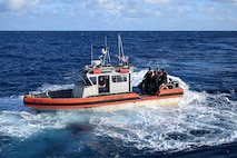 A Legend-class U.S. Coast Guard Cutter Stratton (WMSL 752) 35-foot Long Range Interceptor II small boat crew and Able Seaman  from the Republic of the Marshall Islands (RMI) Sea Patrol transit toward a fishing vessel to conduct a fisheries boarding within RMI’s exclusive economic zone, July 10, 2025.