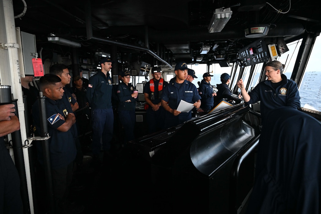 Able Seaman from the Republic of the Marshall Islands (RMI) Sea Patrol and U.S. Coast Guard members assigned to the Legend-class U.S. Coast Guard Cutter Stratton (WMSL 752) conduct a brief on Stratton’s bridge prior to a fisheries boarding in the RMI’s exclusive economic zone, July 10, 2025.