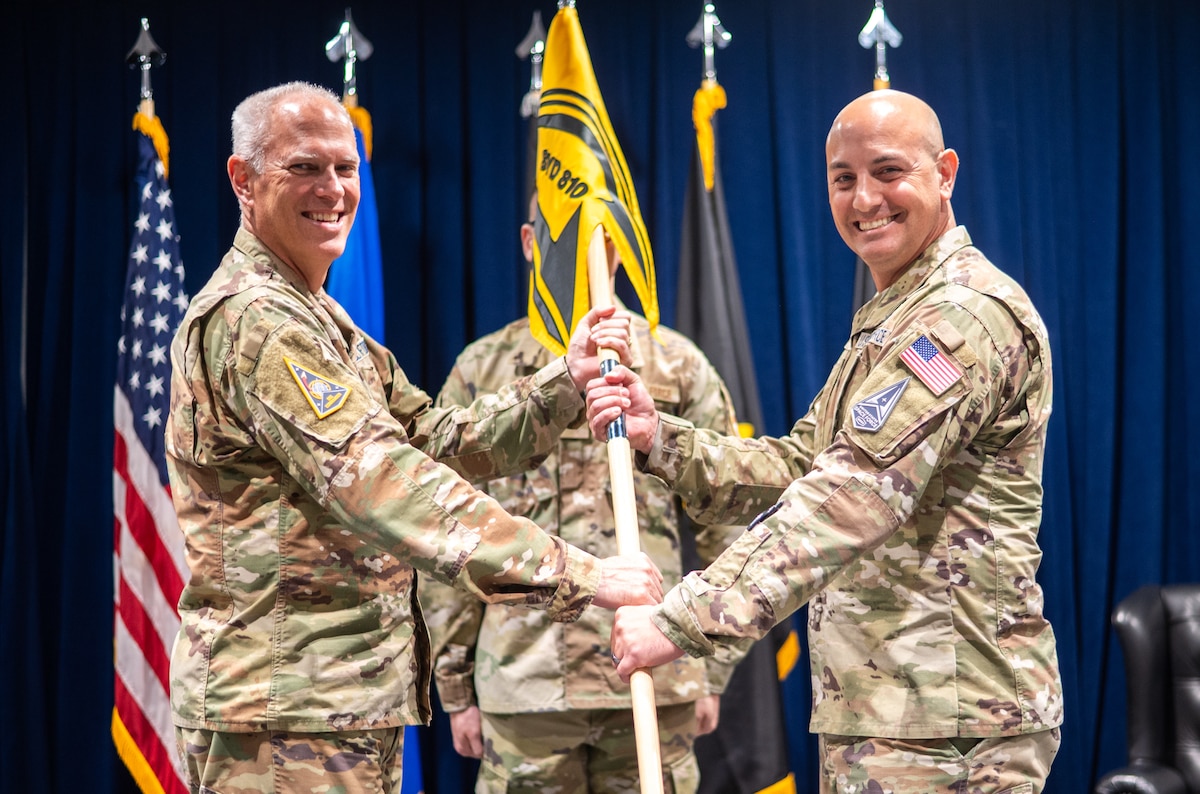 Lt. Gen. Philip A. Garrant, SSC commander passes the SYD 810 guidon to Col. Dane Bannach, commander, SYD 810, Space-Based Sensing & Targeting, officially activating the second Space Sensing System Delta in an Activation Ceremony at the Space Systems Command’s headquarters at Los Angeles Air Force Base, Jul. 10, 2025. [U.S. Space Force Photo by: Van Ha]