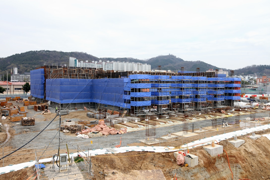 Construction is underway on the new, uniquely designed two-story Vehicle Maintenance Facility (VMF) at Camp Carroll, South Korea. Managed by the U.S. Army Corps of Engineers, Far East District, the $44 million facility includes multiple work bays, integrated workshops, wash bays, and eight bridge cranes. This innovative vertical design maximizes limited space while enhancing maintenance capabilities and logistics support for U.S. Army operations across the Pacific region. (U.S. Army photo by Yo Kyong-il)
