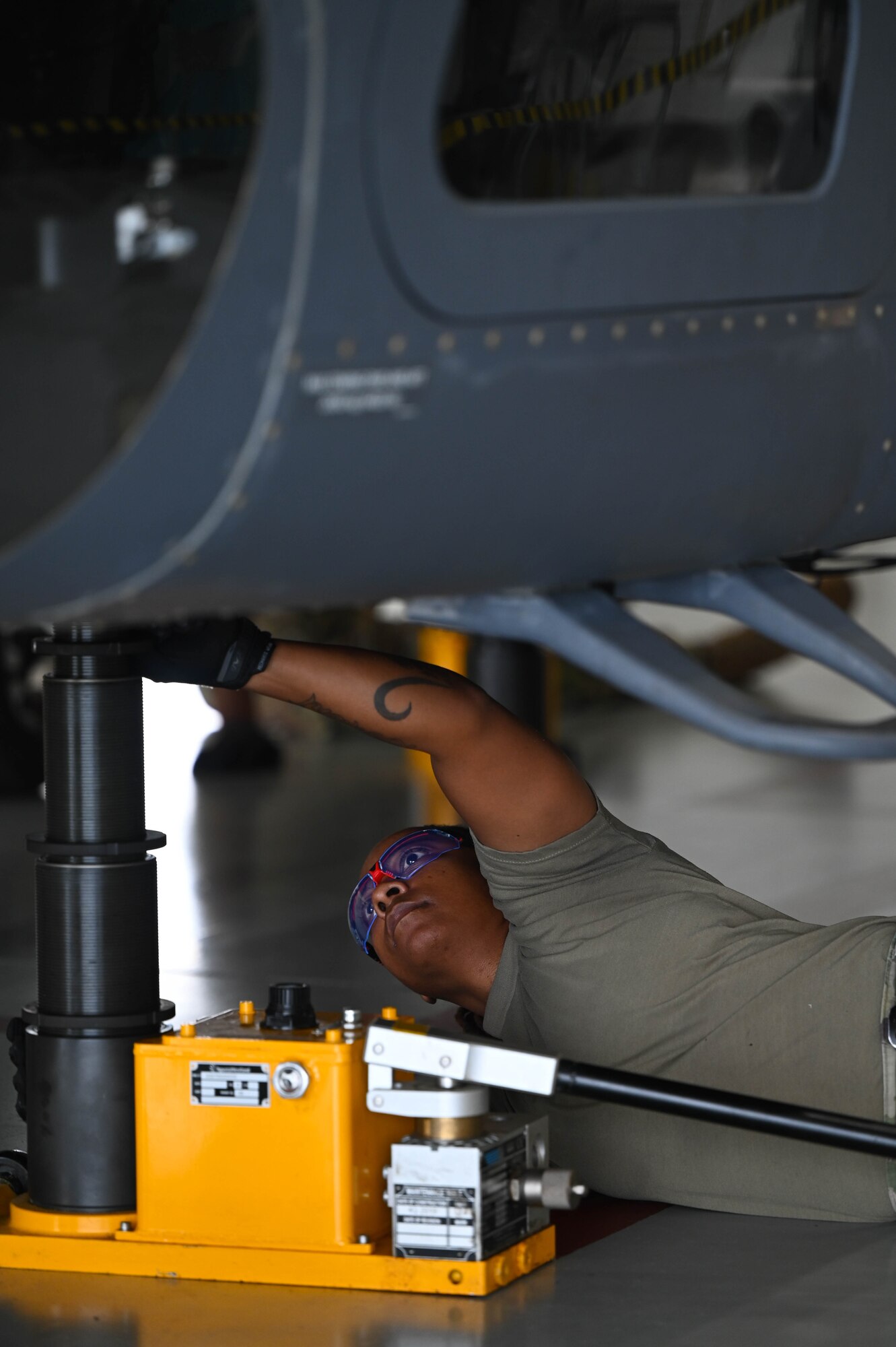 a person works on a helicopter