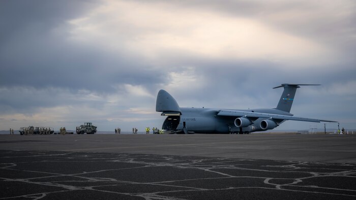 Airman unload C-5M Super Galaxy aircraft