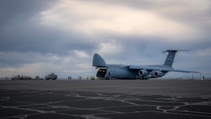 Airman unload C-5M Super Galaxy aircraft