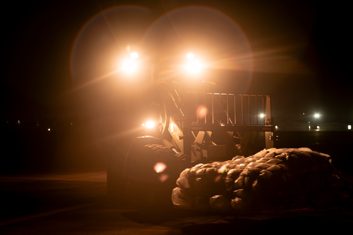 Airman operates forklift
