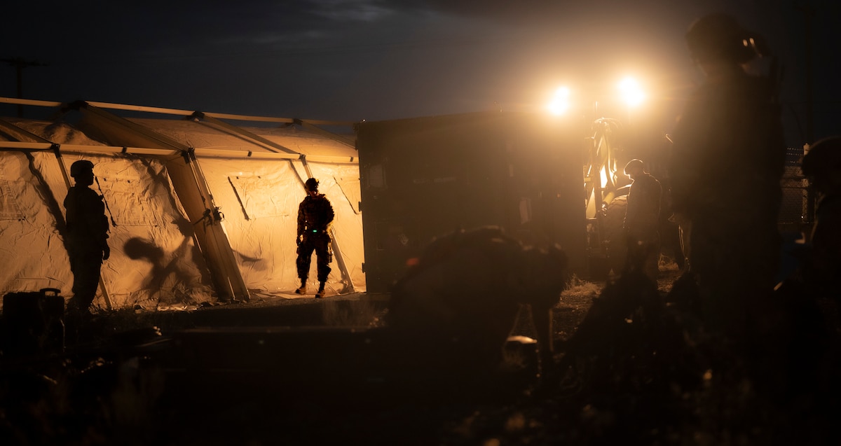 Airman work together to set up an airbase