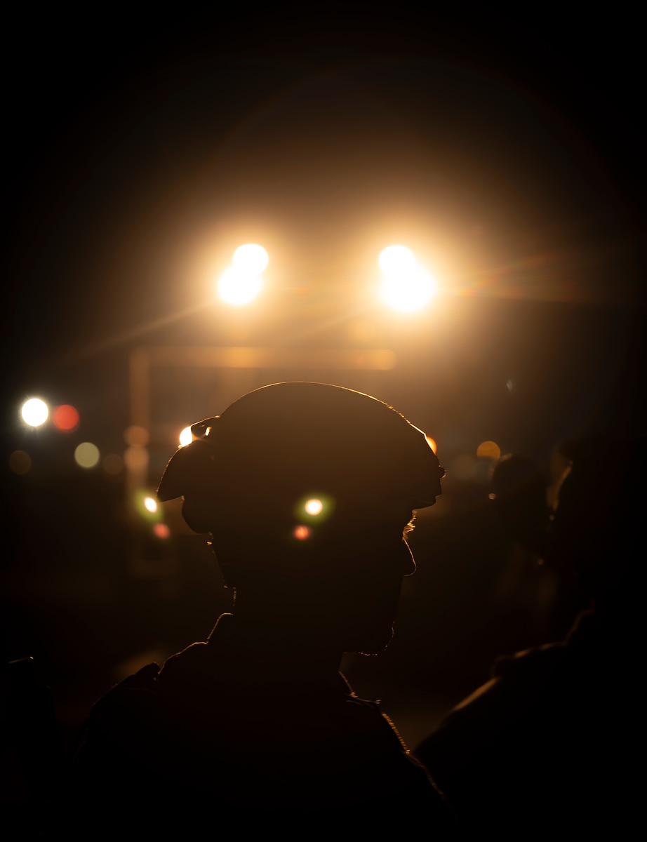Airman stands in the dark