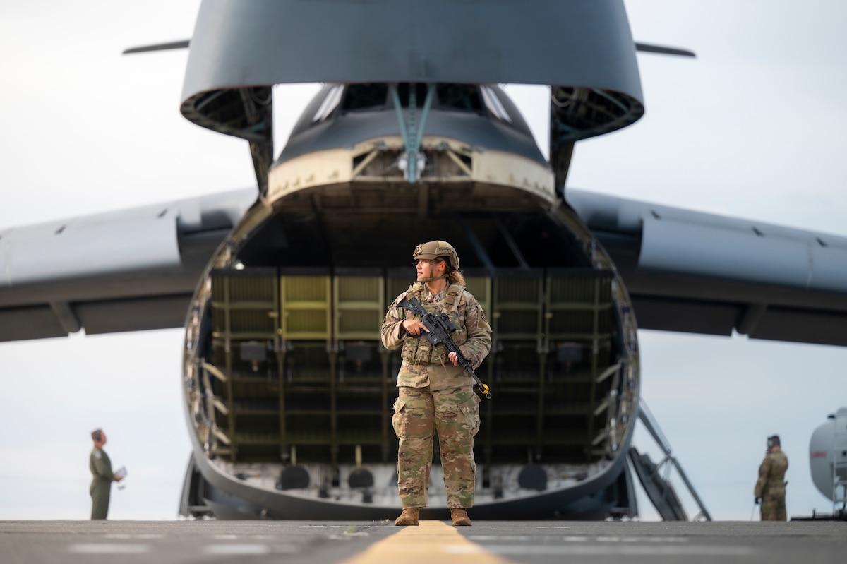 Airman guards plane