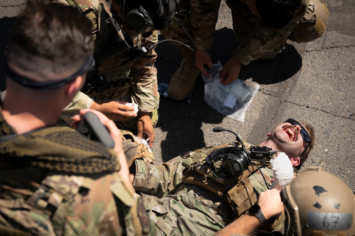 Airmen work on tactical combat casualty care scenario