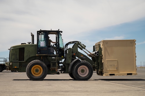 Airman operates forklift