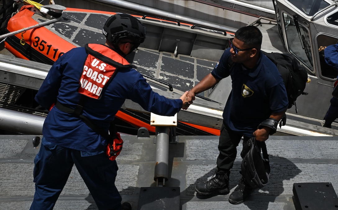Crew members from the Legend-class U.S. Coast Guard Cutter Stratton (WMSL 752) welcome aboard Republic of the Marshall Islands (RMI) Sea Patrol Able Seaman for bilateral maritime law enforcement operations in RMI waters, July 9, 2025.