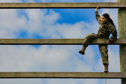 U.S. Army Staff Sgt. Melyssa Vazquez, a public affairs specialist with the 213th Regional Support Group, Pennsylvania National Guard, scales an obstacle on the confidence course at Fort Indiantown Gap, Pennsylvania, July 22, 2025.