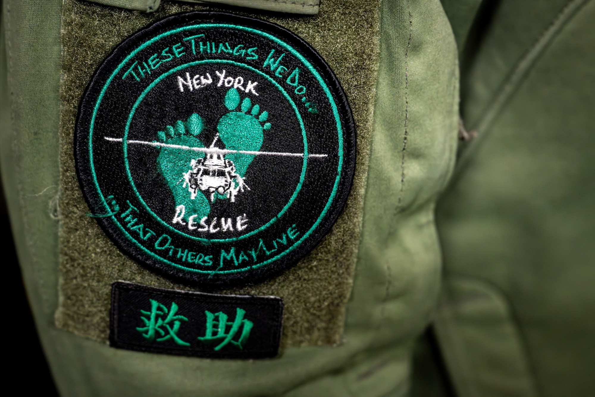 A U.S. Air Force Airman assigned to the 106th Rescue Wing wears a patch ahead of its support of exercise Resolute Force Pacific (REFORPAC) 2025 at Misawa Air Base, Japan, July 11, 2025.