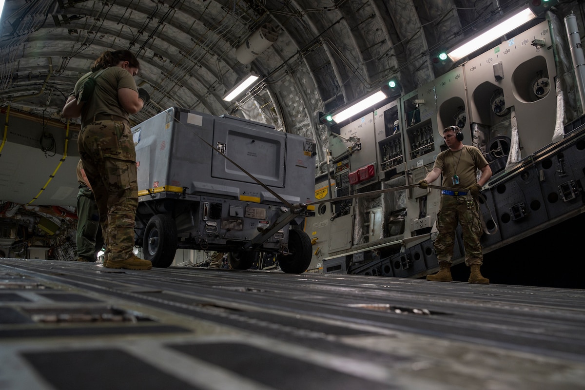 U.S. Air Force Airmen assigned to the 730th Air Mobility Squadron unload cargo from a C-17 Globemaster III aircraft during exercise Resolute Force Pacific (REFORPAC) 2025 at Misawa Air Base, Japan, July 18, 2025.