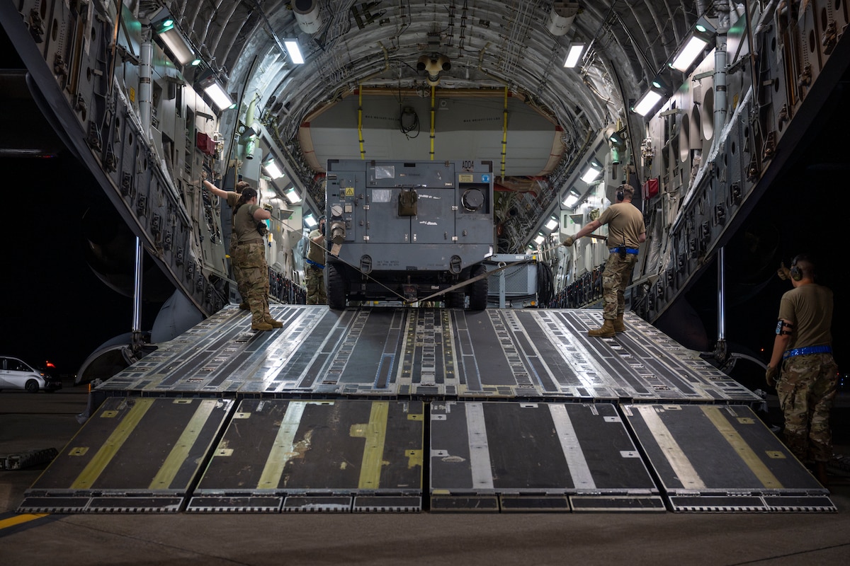 U.S. Air Force Airmen assigned to the 730th Air Mobility Squadron unload cargo from a C-17 Globemaster III aircraft during exercise Resolute Force Pacific (REFORPAC) 2025 at Misawa Air Base, Japan, July 18, 2025.