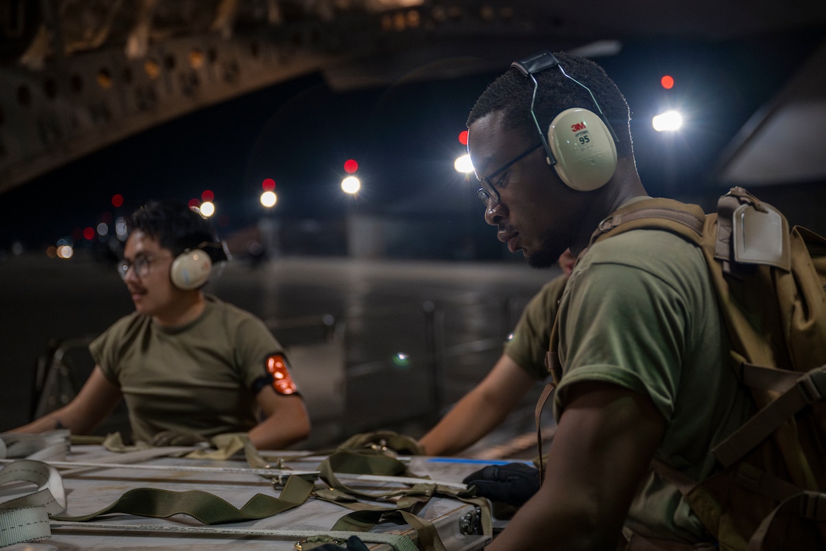 U.S. Air Force Airmen assigned to the 730th Air Mobility Squadron prepare to unload cargo from a C-17 Globemaster III aircraft during exercise Resolute Force Pacific (REFORPAC) 2025 at Misawa Air Base, Japan, July 18, 2025.