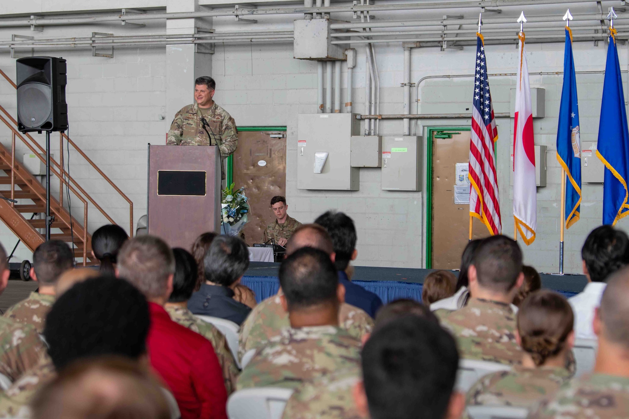 military member gives speech on podium