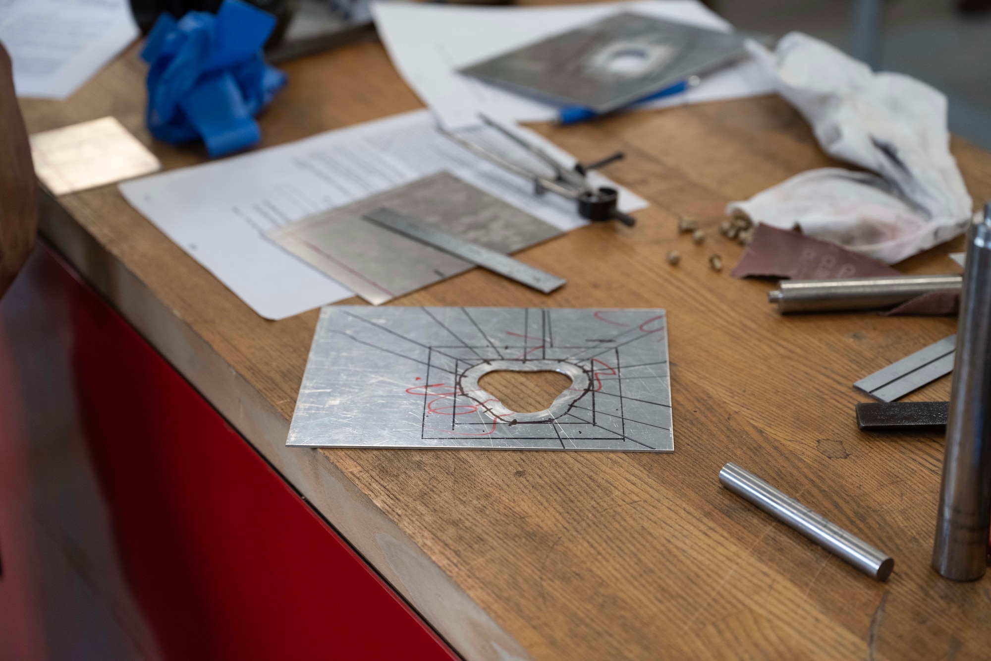 Tools and repair materials used during Aircraft Battle Damage Repair Evaluation training are displayed on a workbench at Incirlik Air Base, Türkiye, July 16, 2025. The course guides Airmen through realistic damage scenarios and hands-on recovery techniques to restore aircraft functionality in contested environments.