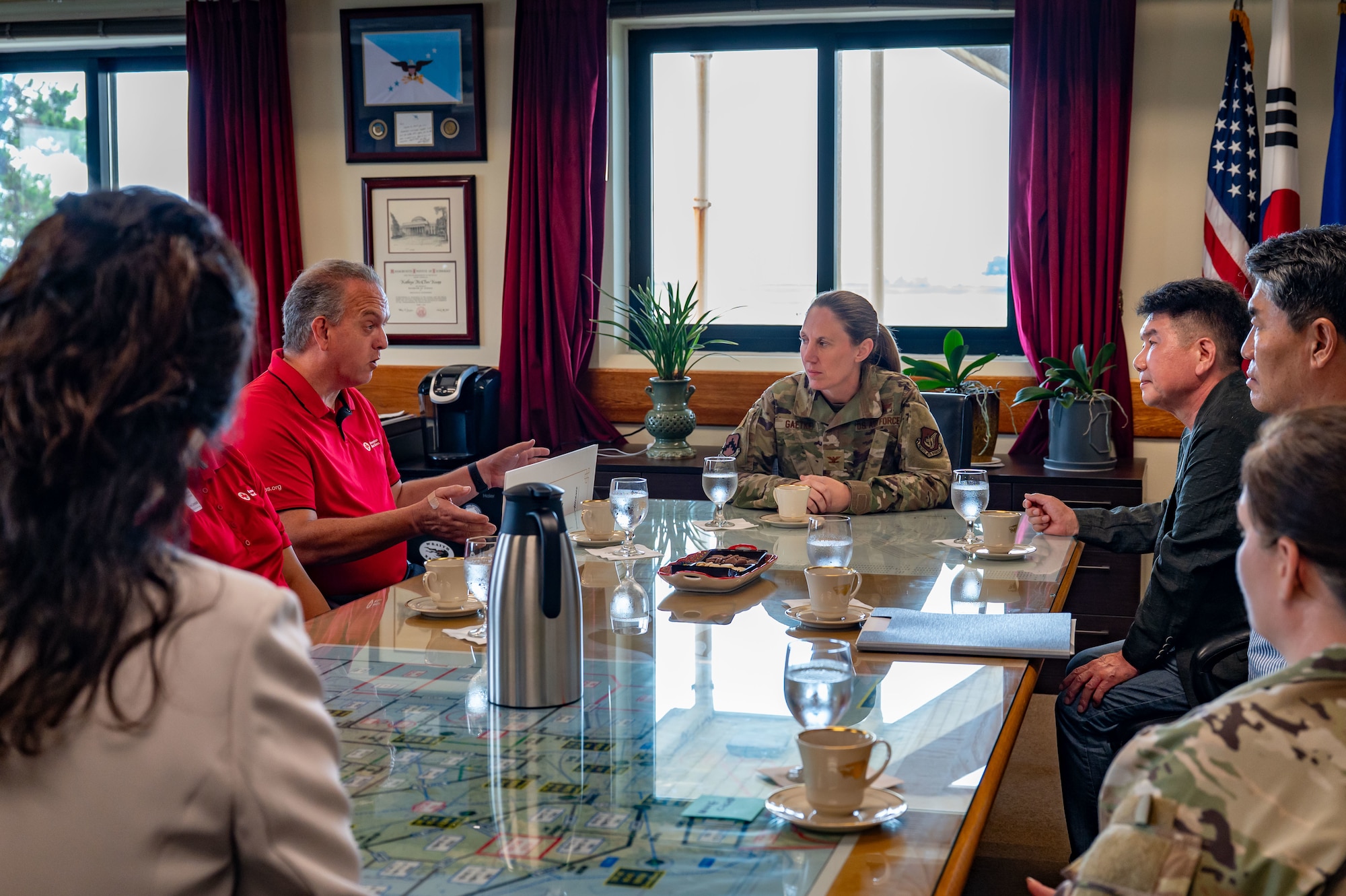 Brian Mumahan, American Red Cross Service to the Armed Forces Korea region regional program director, addresses members of the Korean-American Gunsan Alliance and 8th Fighter Wing command staff regarding the donation made by KAGA
