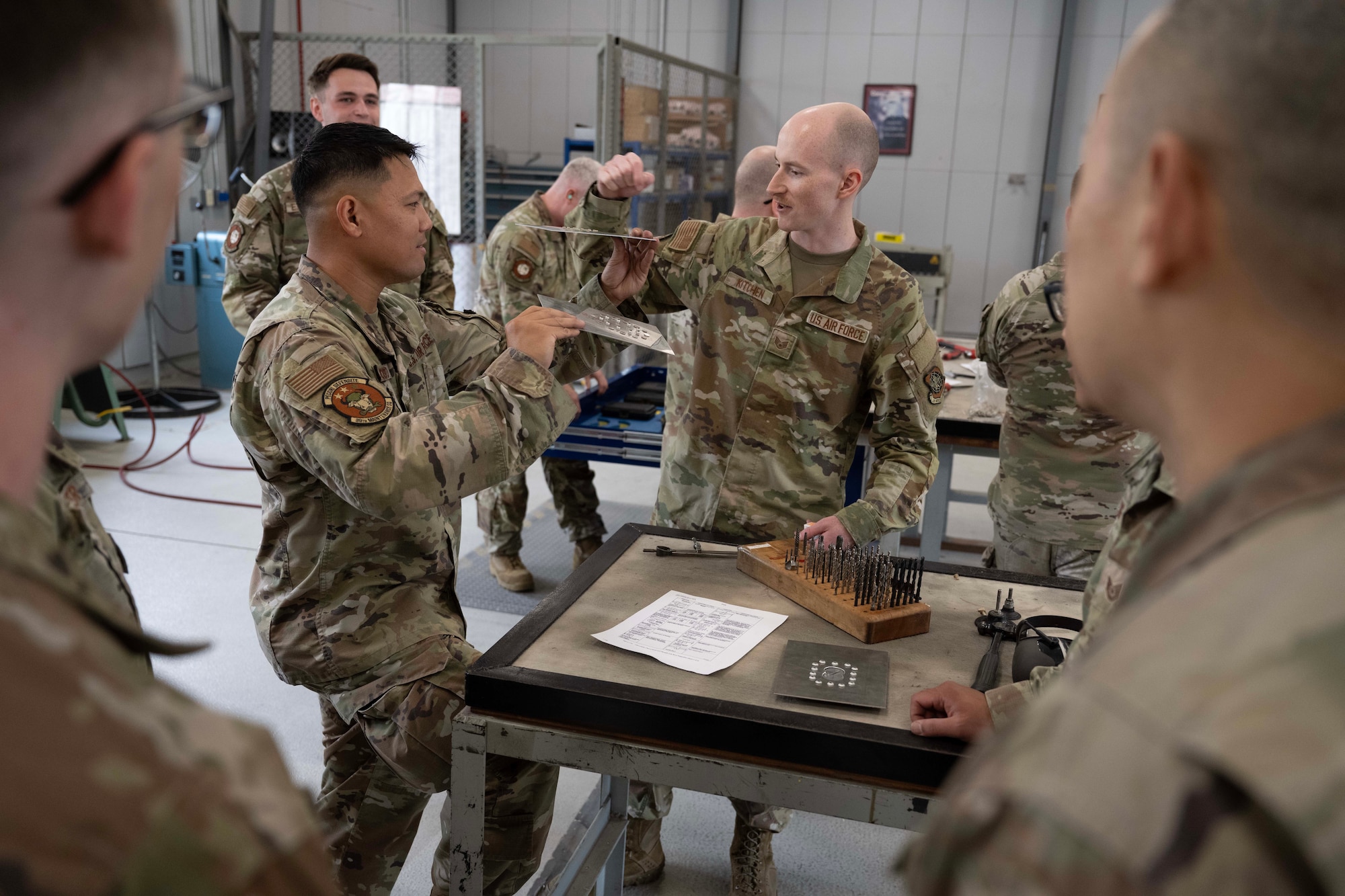 U.S. Air Force Airmen from the 39th Maintenance Squadron and 728th Air Mobility Squadron perform hands-on training during Aircraft Battle Damage Repair Evaluation at Incirlik Air Base, Türkiye, July 16, 2025. The training simulates aircraft damage and guides participants through the full repair process, from assessment to patch installation.