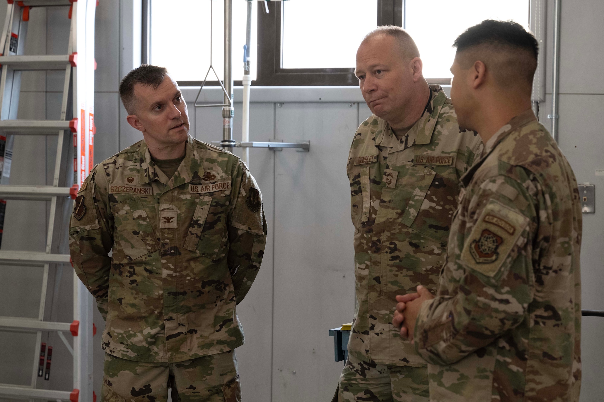 U.S. Air Force Col. John Szczepanski, 39th Weapons System Security Group commander, and Chief Master Sgt. William Hensley, WSSG senior enlisted leader, speaks with Airmen during Aircraft Battle Damage Repair Evaluation training at Incirlik Air Base, Türkiye, July 16, 2025. Leadership engagement highlighted the importance of readiness, adaptability, and mission-focused maintenance in contested environments.
