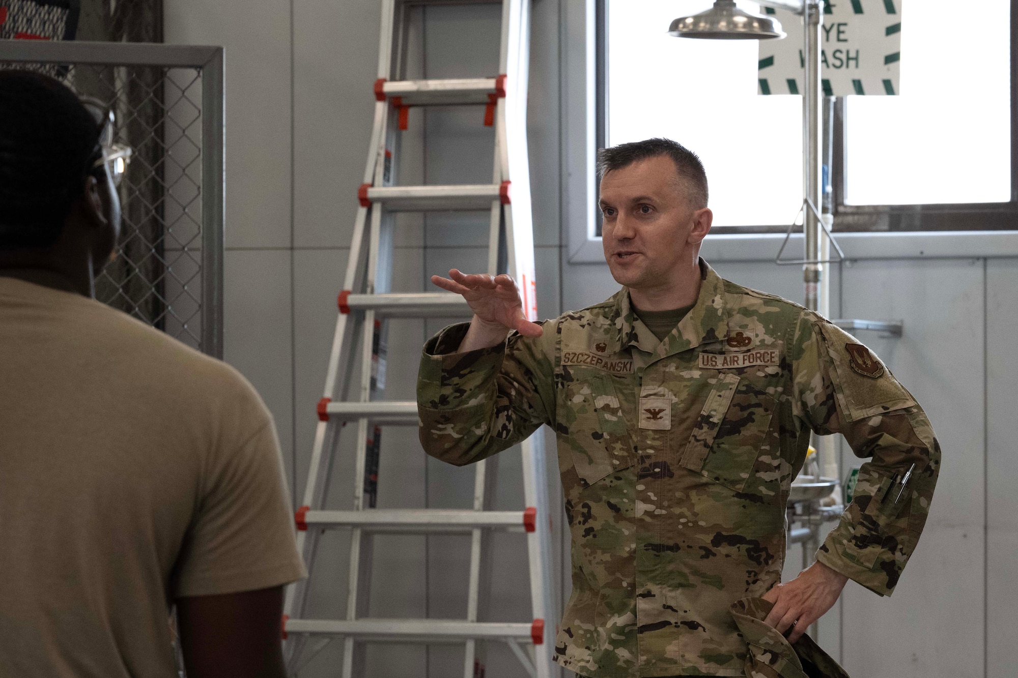 U.S. Air Force Col. John Szczepanski, 39th Weapons System Security Group commander, speaks with members of the 728th Air Mobility Squadron and 39th Maintenance Squadron during Aircraft Battle Damage Repair Evaluation training at Incirlik Air Base, Türkiye, July 16, 2025. The conversation emphasized the value of building technical proficiency and readiness for real-world maintenance scenarios.