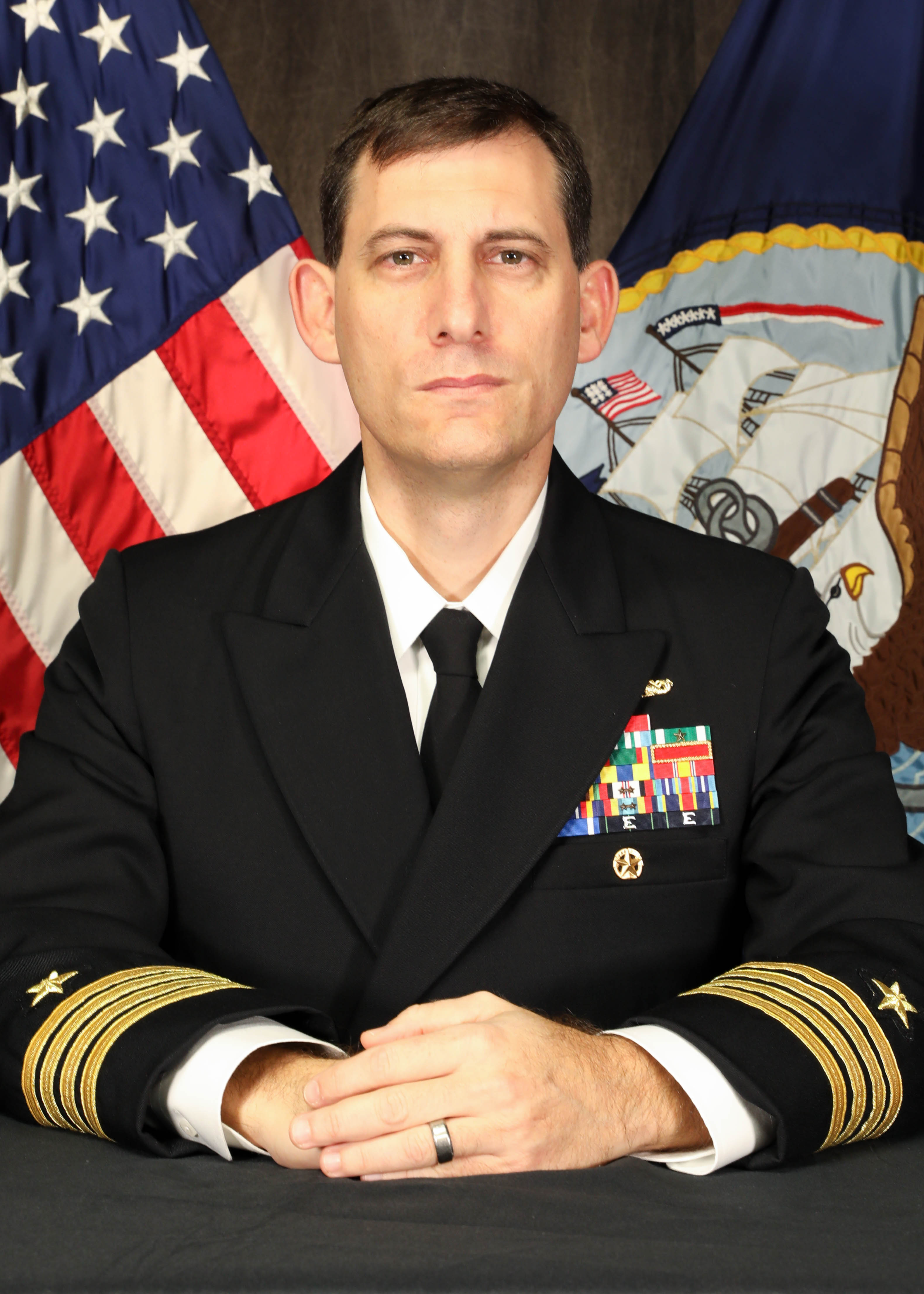 Official photo of CAPT Jim Lembo wearing the U.S. Navy service dress blue uniform.