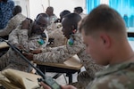 U.S. Soldiers assigned to the Kentucky Army National Guard participate in a radio communications knowledge exchange with Djiboutian soldiers at the Djiboutian signal corps compound in Djibouti City, Djibouti, July 14, 2025. The State Partnership Program conducts military-to-military engagements in support of U.S. defense and security goals, facilitating cooperation across all levels of international civil-military affairs, and encouraging relationship building at the state level.