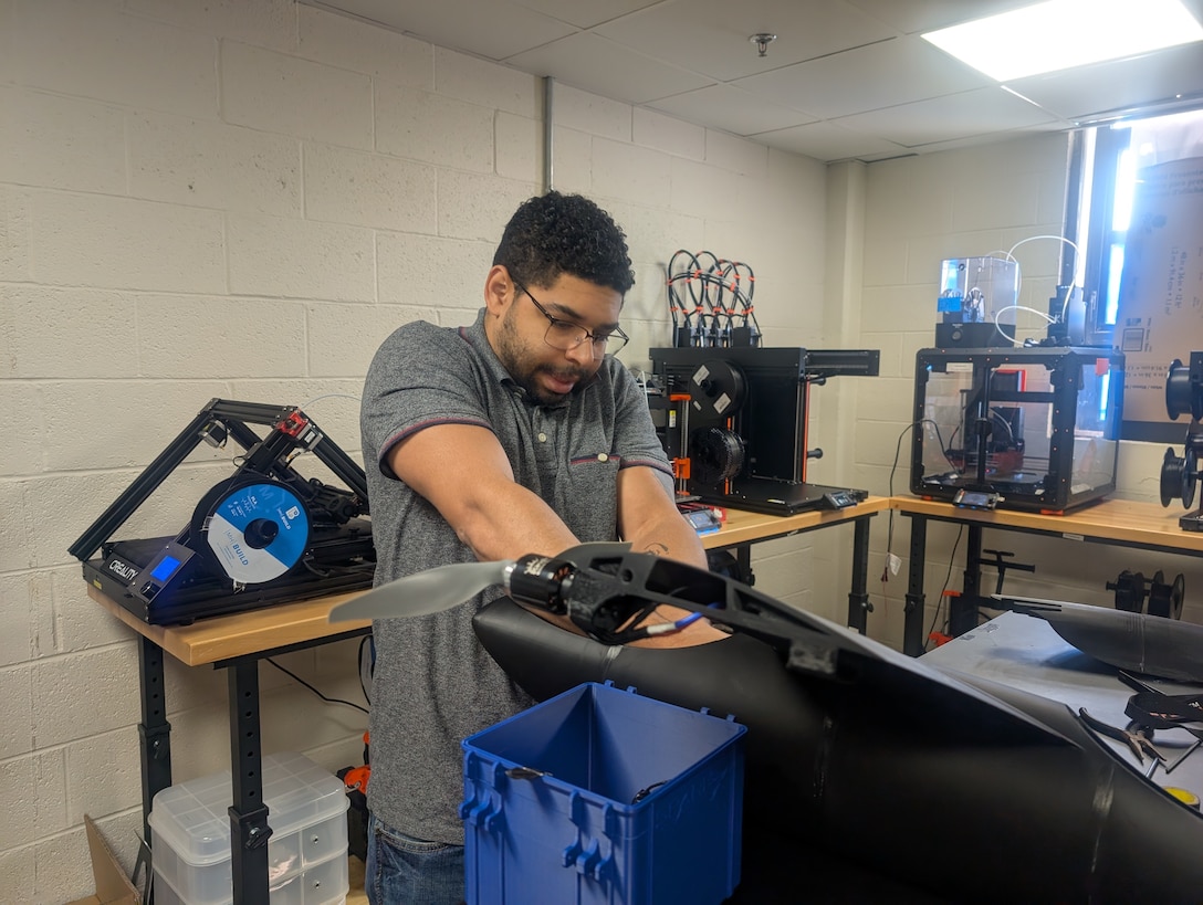 U.S. Air Force Staff Sgt. Stefan N. Sobiech, a SparkX Cell Innovation and Idea Center technician, assembles a Blackbird unmanned aircraft system in September 2024, at Joint Base Andrews, Md.  The SparkX team’s modular 3D-printed design enables rapid field assembly and mission-specific customization without the need for specialized tools.