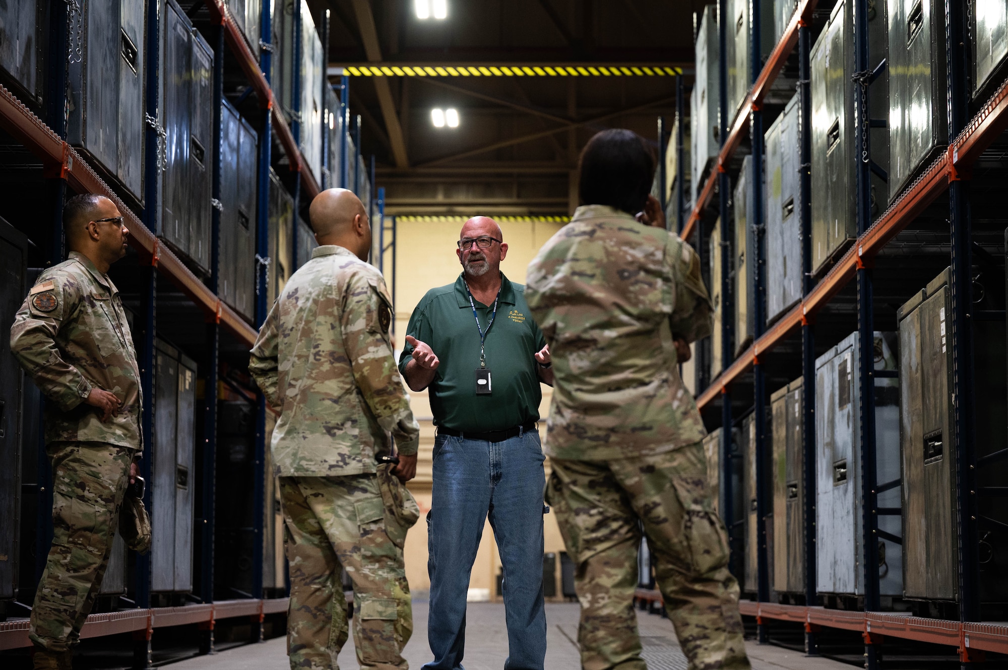 Members of the U.S. Air Force Reserve Senior Enlisted Council talk with Glenn Johnson, Air Force Material Command management analyst, during a base tour at Grissom Air Reserve Base, Ind., June 24, 2025. Speaking with base personnel guides the RSEC’s decision-making process, allowing for policies and initiatives that drive a more combat-ready force. (U.S. Air Force photo by Senior Airman Elise Faurote)