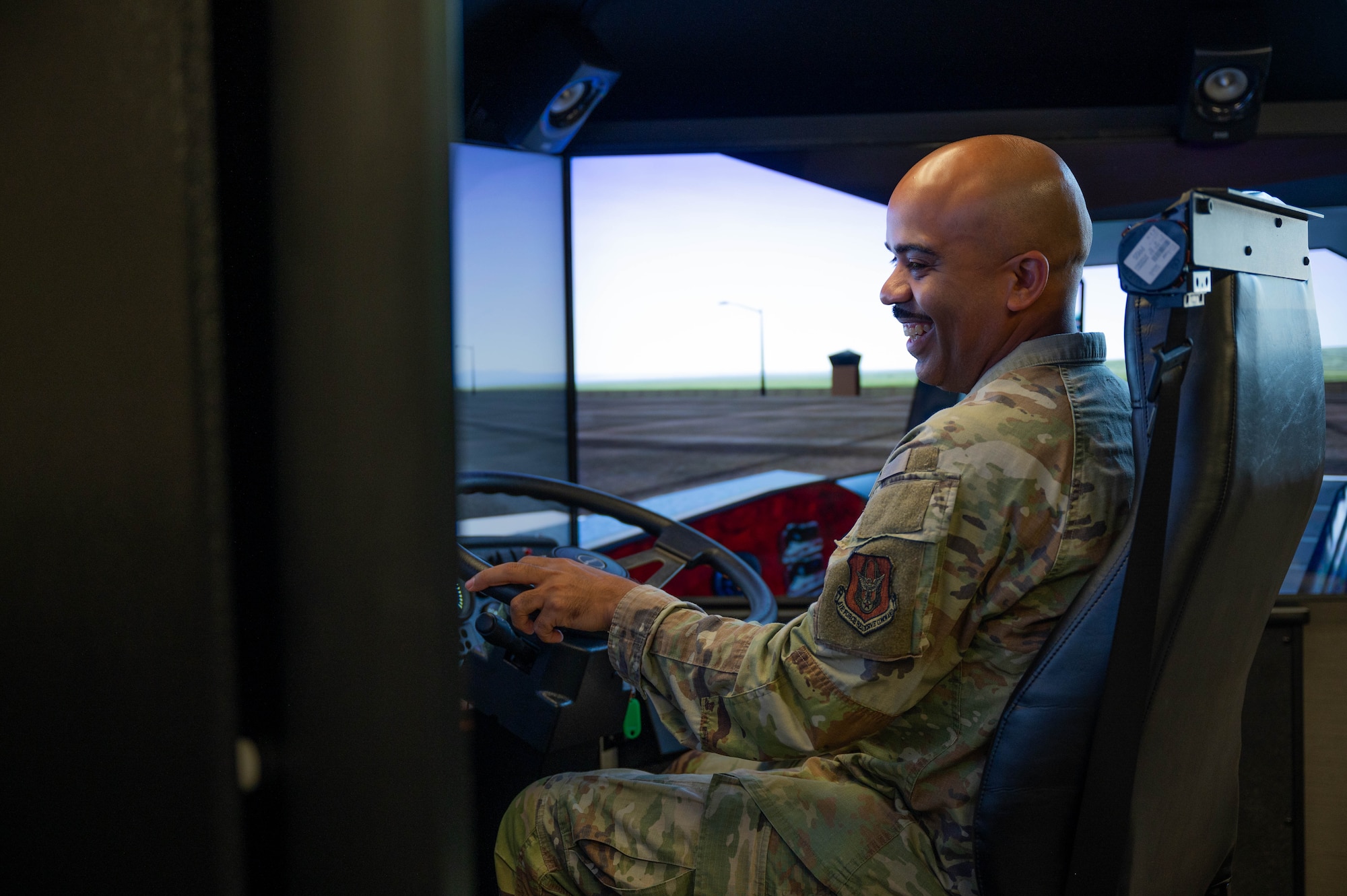 Chief Master Sgt. Israel Nuñez, Senior Enlisted Advisor to the Chief of Air Force Reserve and Command Chief Master Sergeant of Air Force Reserve Command, operates a driving simulator at Grissom Air Reserve Base, Ind., June 25, 2025. Members of the Reserve Senior Enlisted Council learned about the Hoosier Wing’s training initiatives to build and maintain Airmen’s mission readiness. (U.S. Air Force photo by Senior Airman Elise Faurote)
