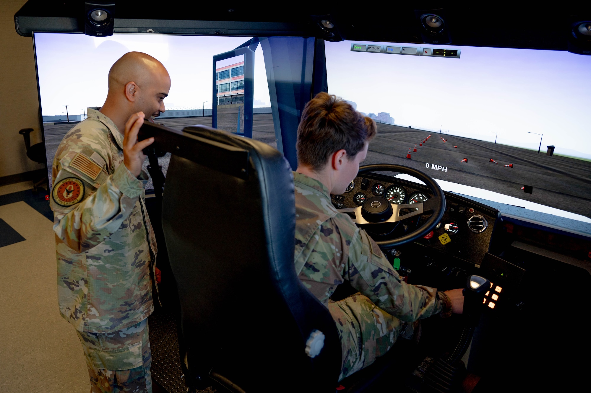 U.S. Air Force Command Chief Master Sgt. Israel Nuñez, Senior Enlisted Advisor to the Chief of Air Force Reserve and Command Chief Master Sgt. of Air Force Reserve Command, watches as an Airman operates the 434th Logistics Readiness Squadron’s driving simulator at Grissom Air Reserve Base, Ind., June 25, 2025. Meeting with personnel drives informed decision-making centered around programs and initiatives that boost combat readiness, lethality, and warrior ethos. (Courtesy photo.)