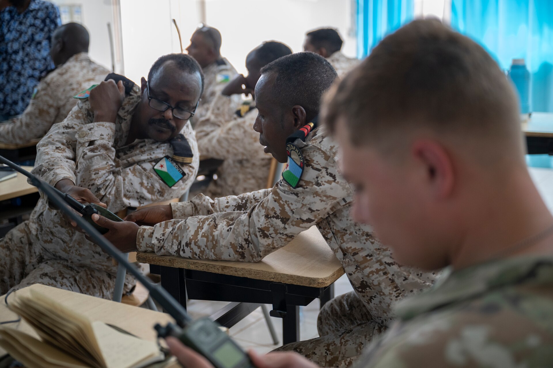Soldiers assigned to the Kentucky Army National Guard participate in a radio communications knowledge exchange with Djiboutian soldiers at the Djiboutian signal corp compound in Djibouti City, Djibouti, July 14, 2025.