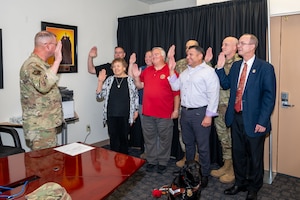 man administers an oath