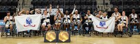 Team Army athletes celebrate after being awarded the wheelchair basketball gold medal by Gen. Stephen Whiting, commander, U.S. Space Command, at the 2025 Department of Defense Warrior Games in Colorado Springs Colorado, July 20, 2025.