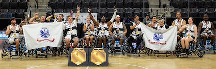 Team Army athletes celebrate after being awarded the wheelchair basketball gold medal by Gen. Stephen Whiting, commander, U.S. Space Command, at the 2025 Department of Defense Warrior Games in Colorado Springs Colorado, July 20, 2025.