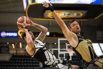U.S. Army Retired Staff Sgt. John Michael Britton leans back for a shot during the wheelchair basketball gold medal game against Team SOCOM at the 2025 Department of Defense Warrior Games in Colorado Springs Colorado, July 20, 2025.